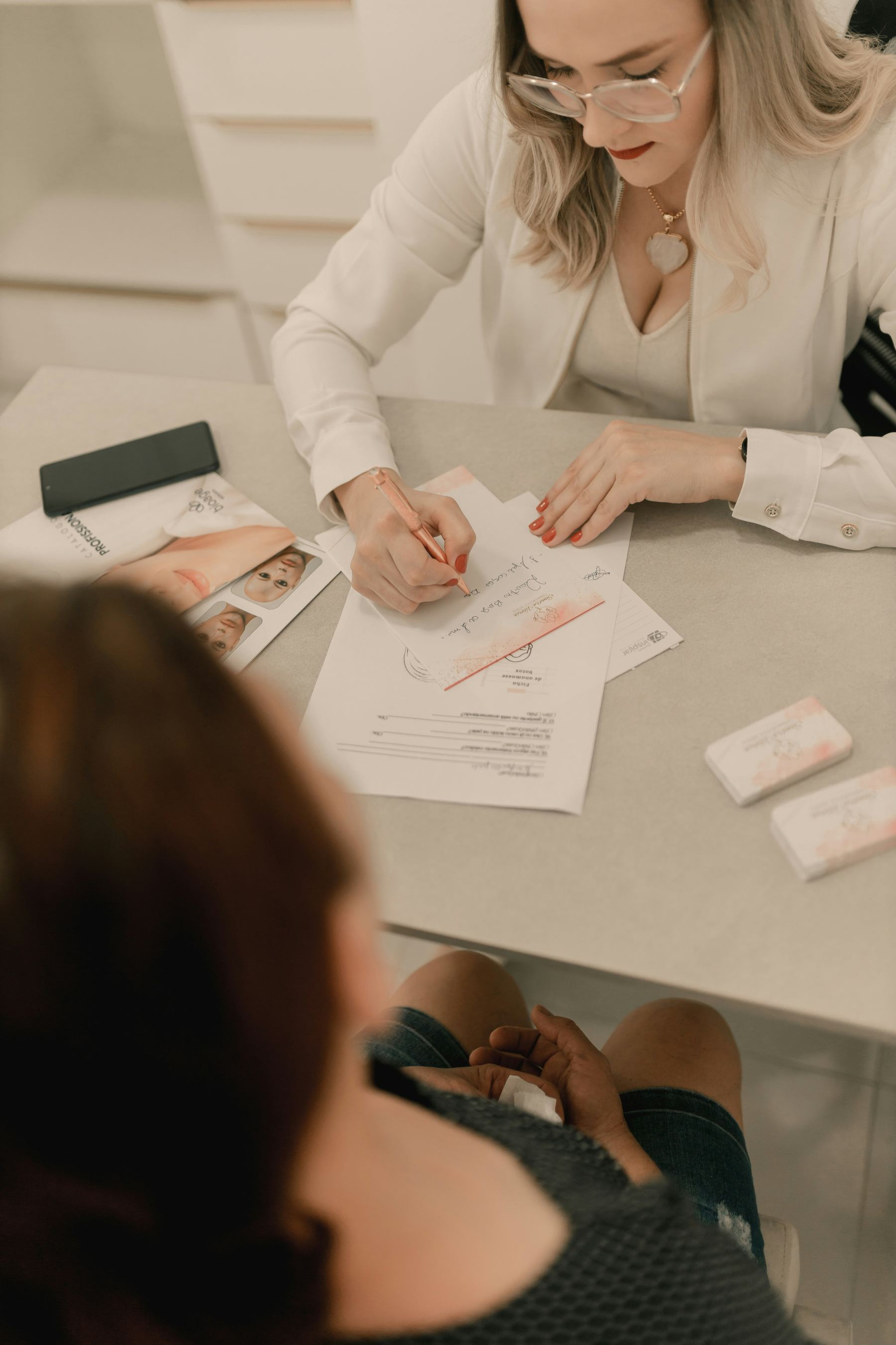 A provider reviewing a treatment plan one-on-one with a patient